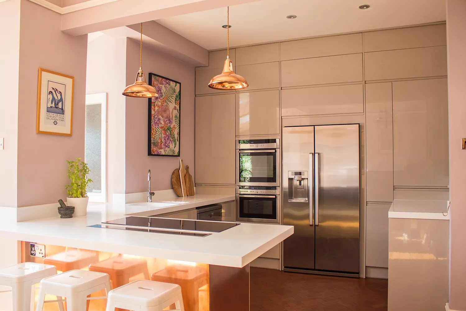 A view if the contemporary copper kitchen featuring the copper pendant lights from Artifact Lighting.