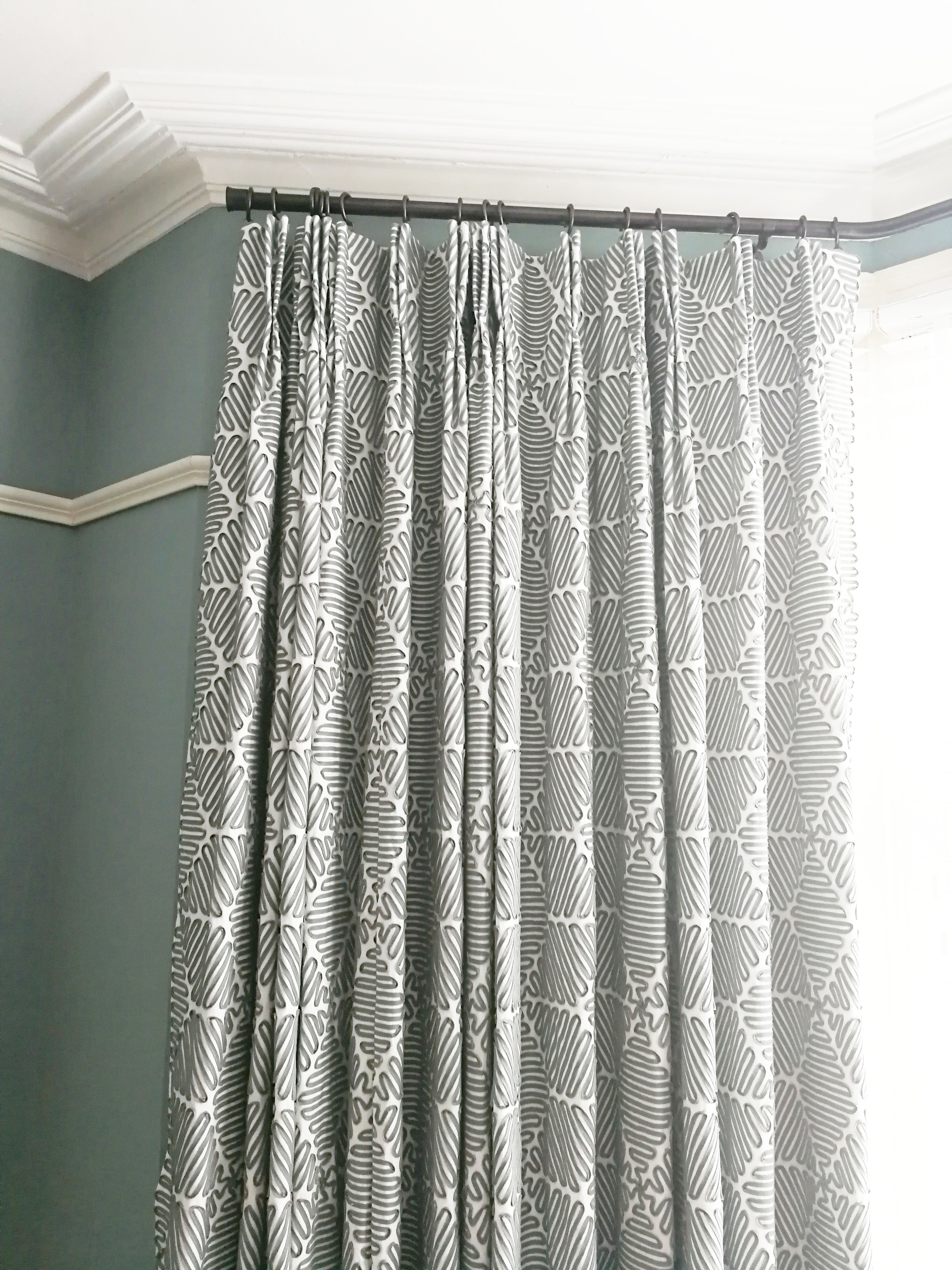 A photo of the curtains with their pleats or folds in place.