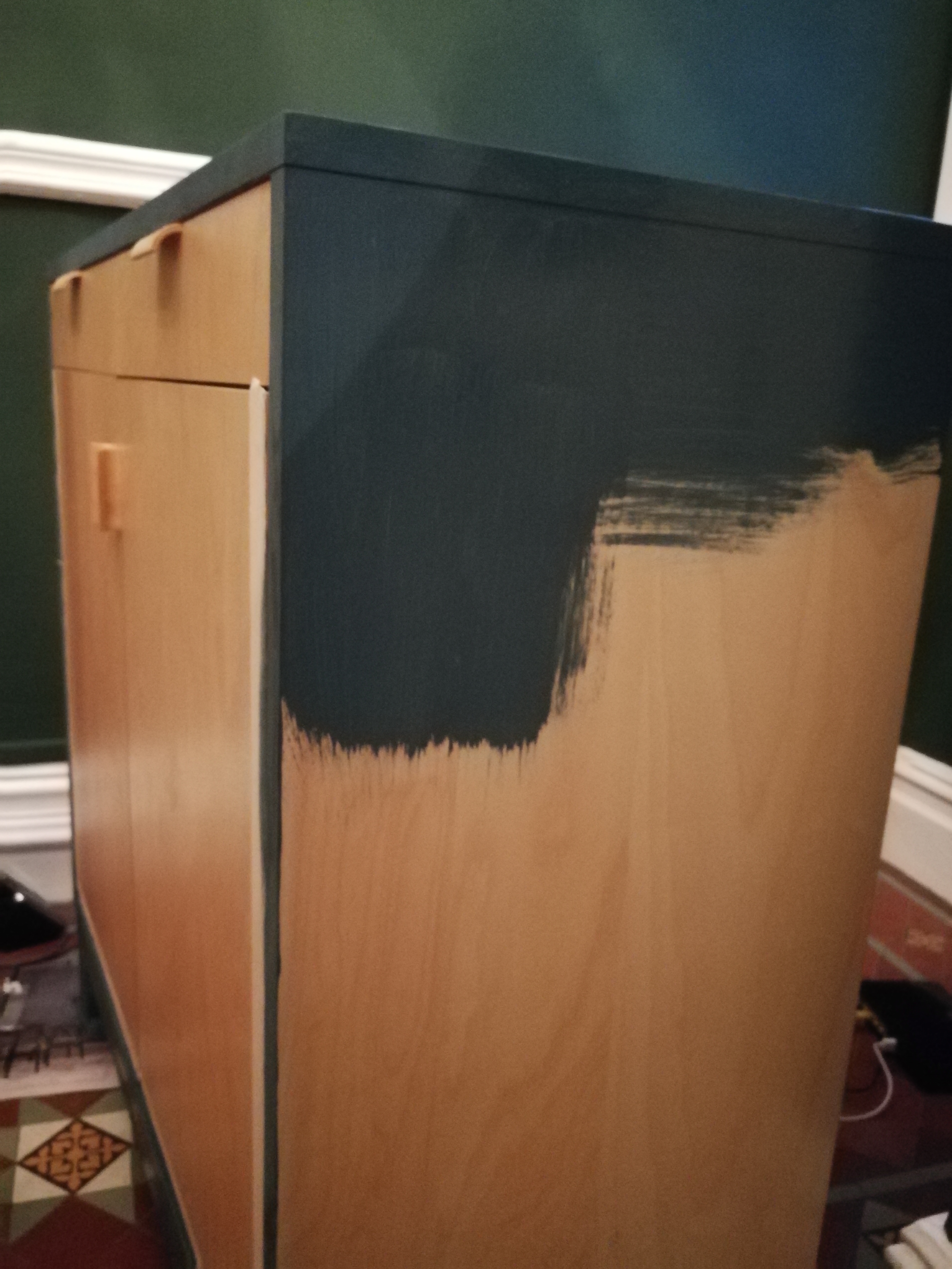 a photo of the cupboard partially painted
