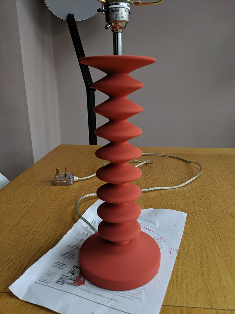 A photo of the lamp with two coats of paint on it.