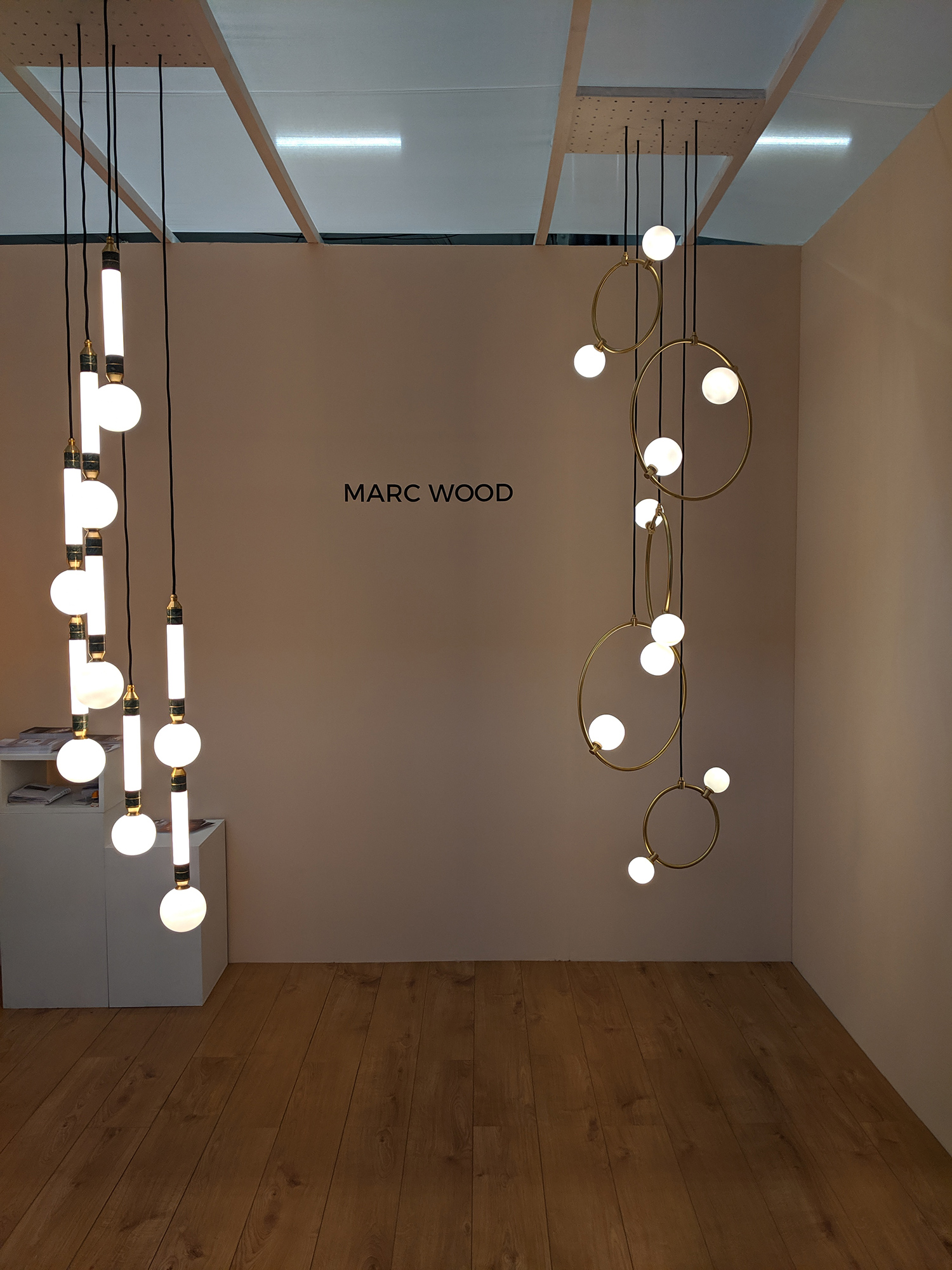A photo of some beautiful circular statement lights at the Marc Wood stand.