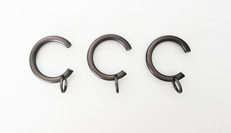 A photo of three 'C' shaped passing rings.