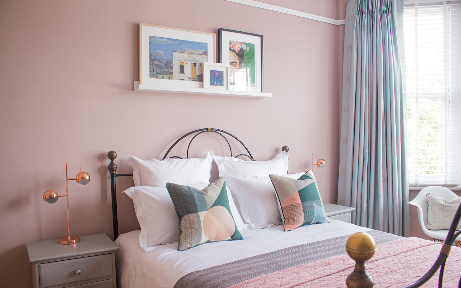 the pink paint colour on the walls, in a finished bedroom project