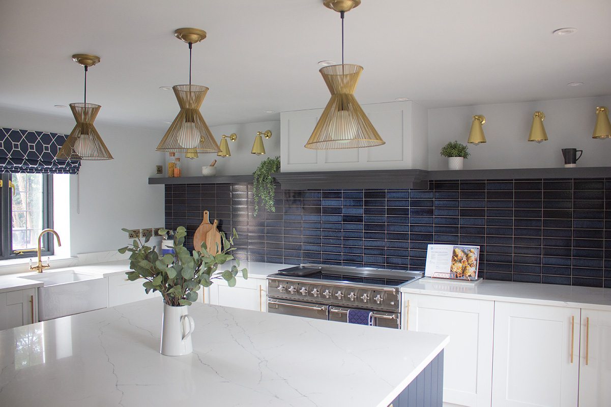 A photo of the finished kitchen with the navy tiles in place.