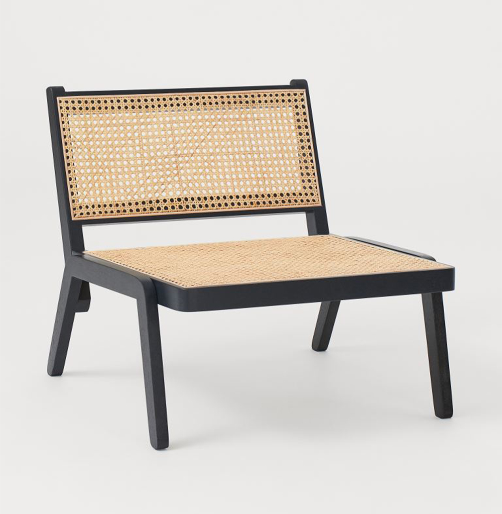A rattan chair from H & M Home.
