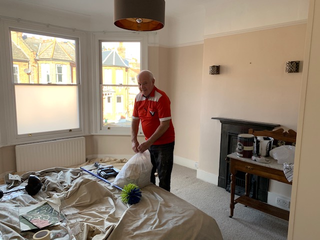 A photo of the client's dad decorating