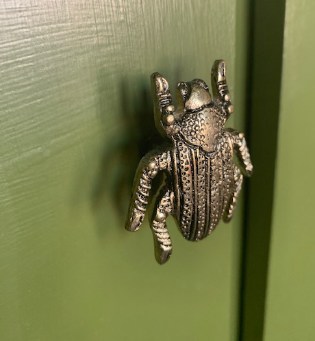 A close up photo of the new beetle shaped brass handles.