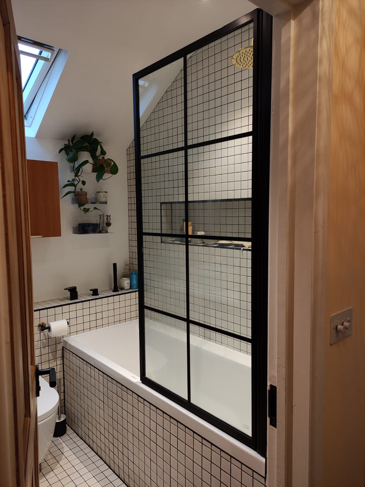 A photo of the finished space showing the shower screen.