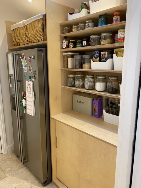 A photo of the finished pantry storage.