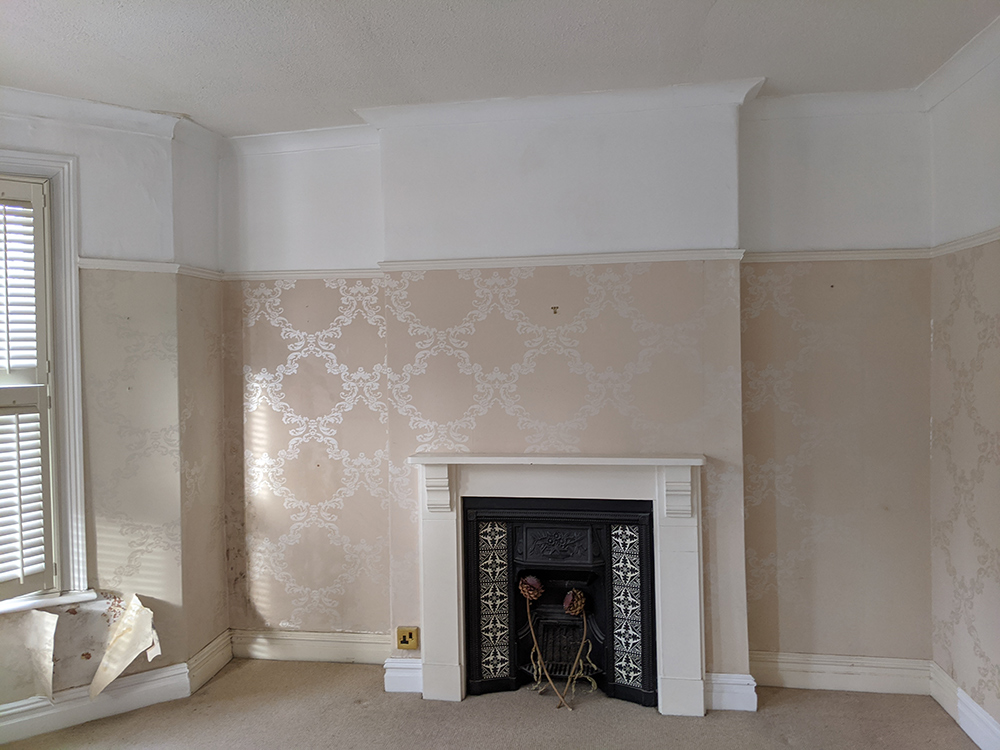 A photo of the main bedroom before we started work.