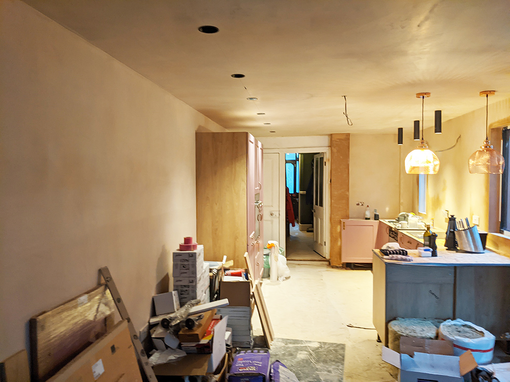 A photo of work in progress on the kitchen, showing the empty wall.