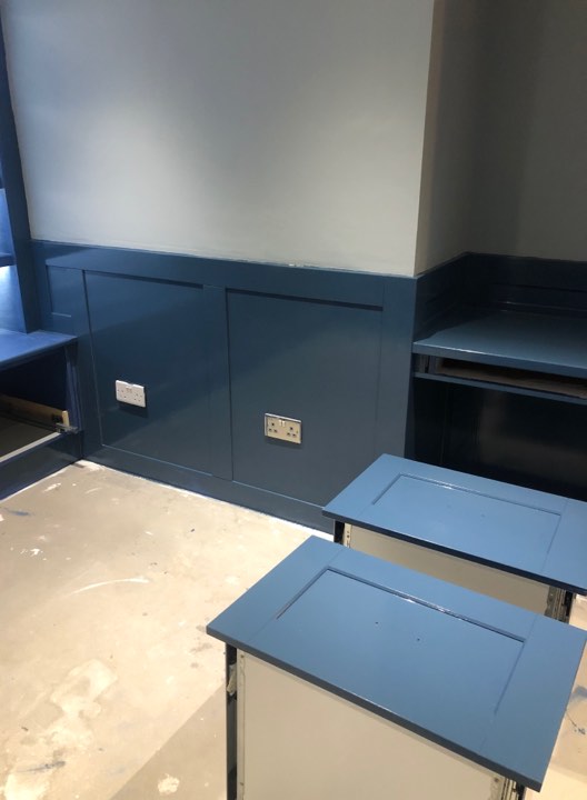 A photo of the cabinetry painted the correct colour