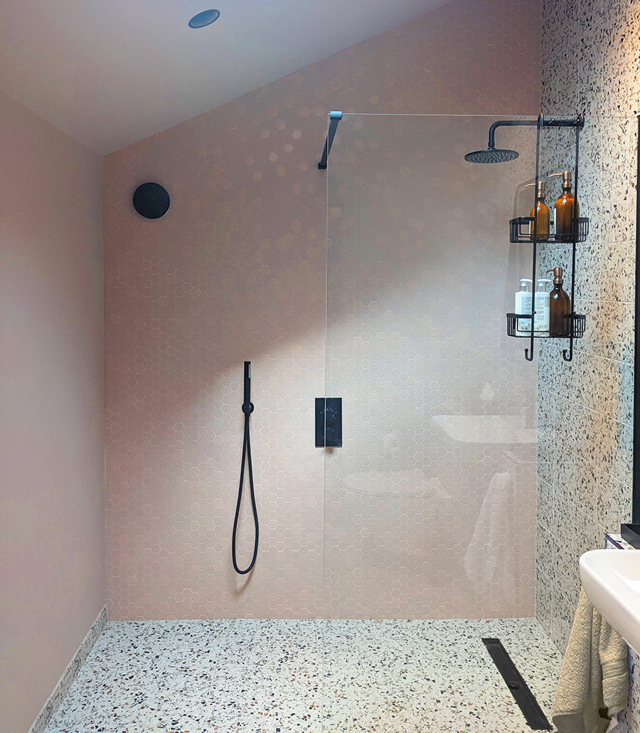 A photo of a wet room I designed using tiles as a feature wall.