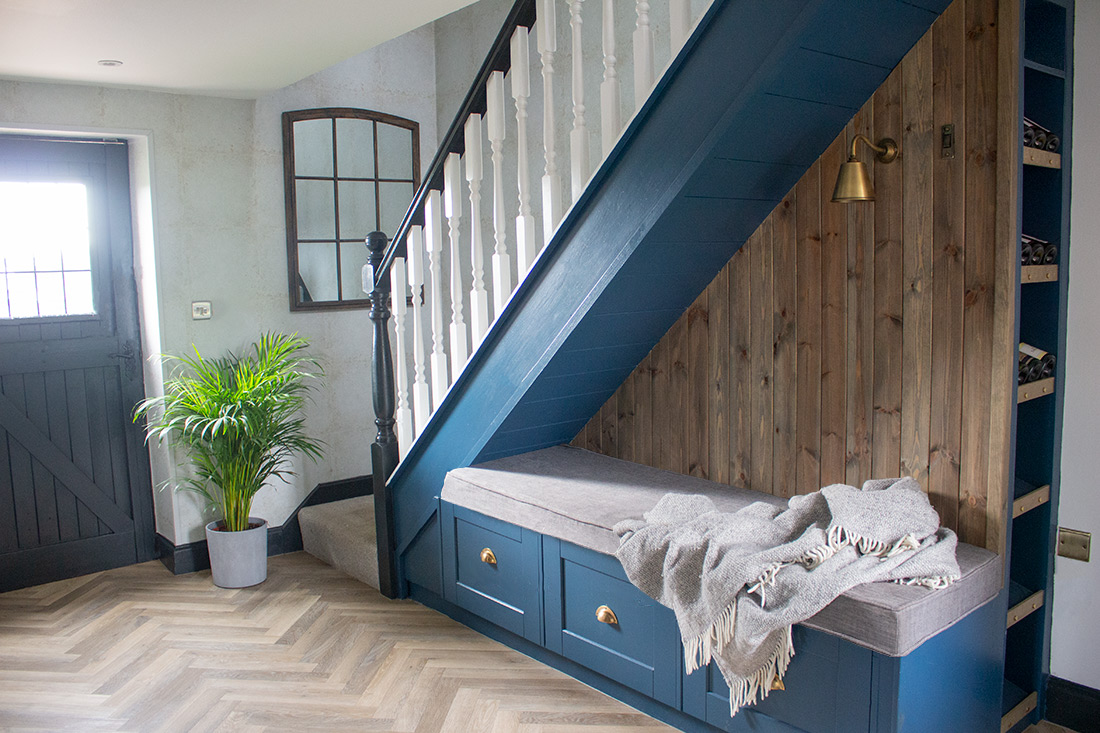 A photo of the hallway in my Modern Country Renovation project, showing a mix of cooler toned woods.