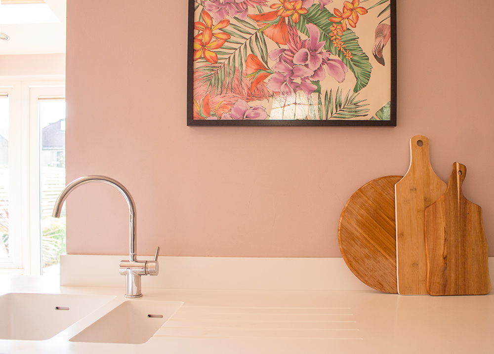 A photo of a shiny chrome, sleek tap in the contemporary copper kitchen project