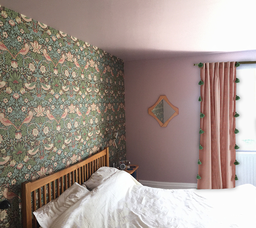 A photo of a feature wall of William Morris wallpaper with a pink ceiling and remaining walls.