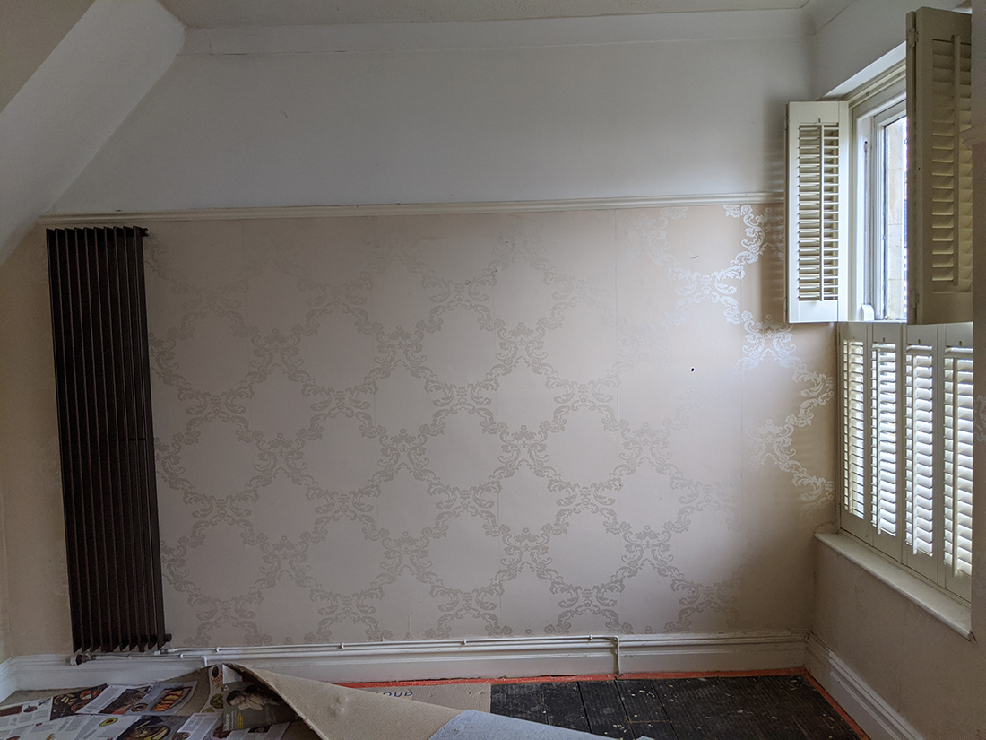 A before photo showing the other side of the main bedroom