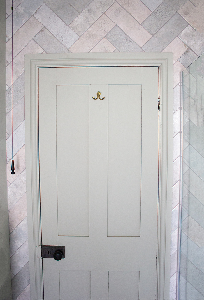 A photo of the painted door and shower area