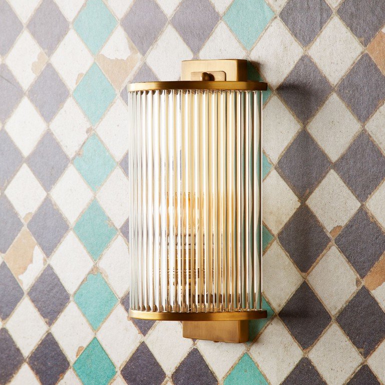 A photo of the wall light made from glass rods