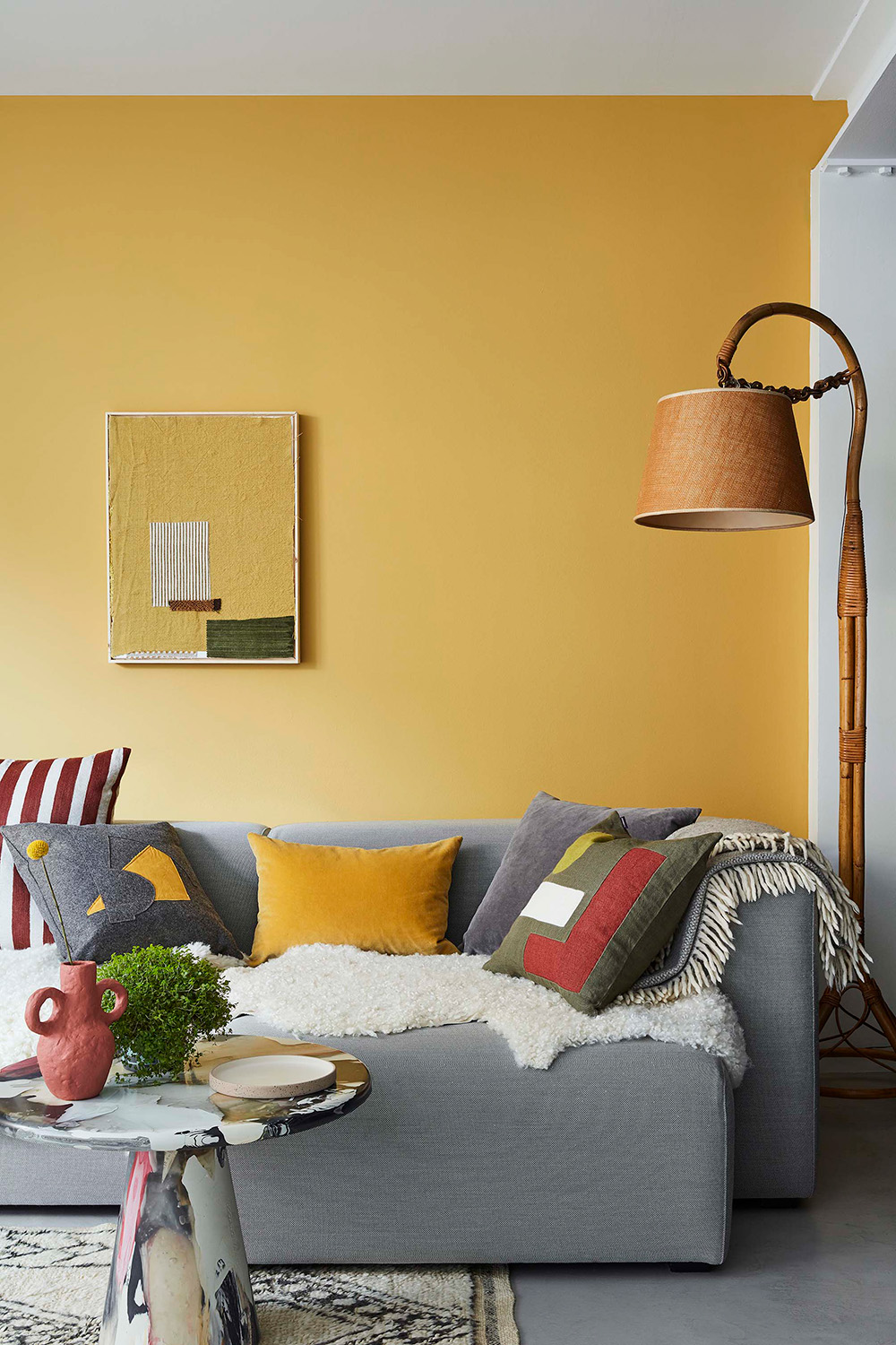 A Little Greene photo showing Yellow Pink Re Mix paint in a living room