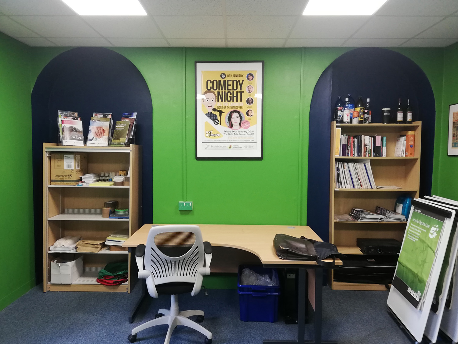 A photo of the finished office showing the green walls and blue alcoves.