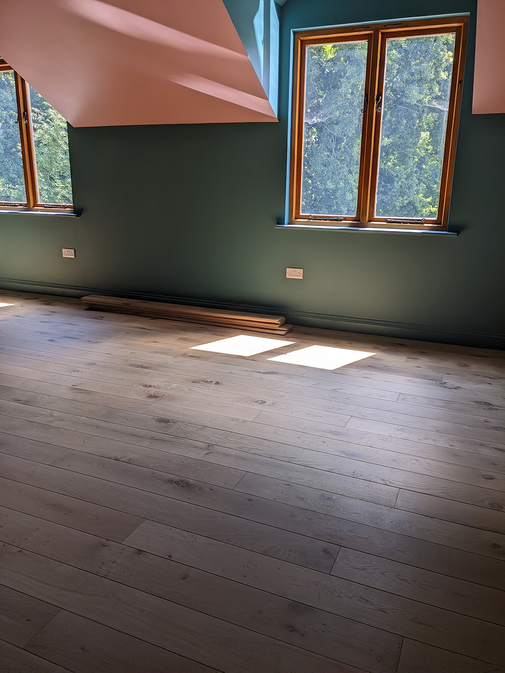 A photo showing the new oak floor in the main bedroom.
