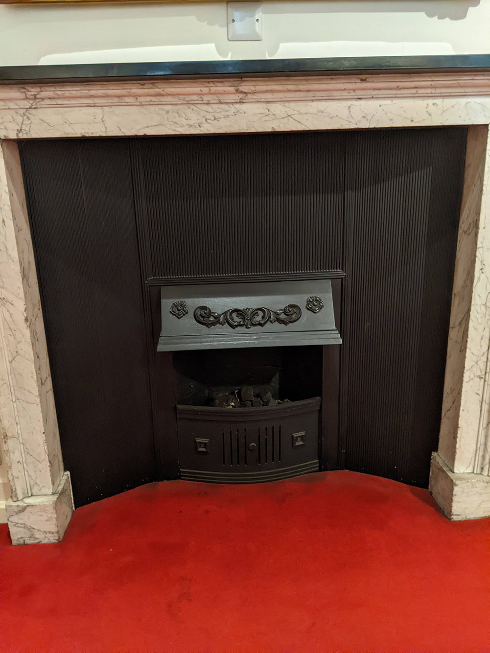 A photo I took of a fireplace with fluted detailing at Blenheim Palace.