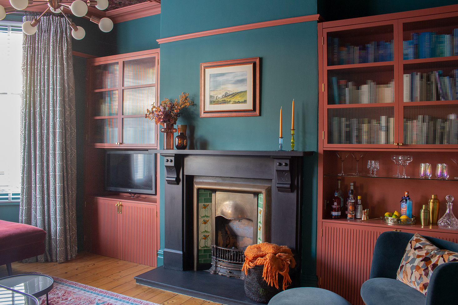 A photo of my living room showing my tall fireplace and my TV in the alcove to the left.