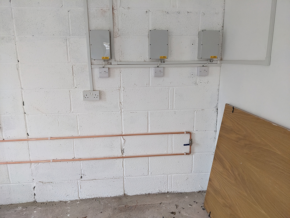 A before photo of the gym showing the valve in it's new position in the corner.