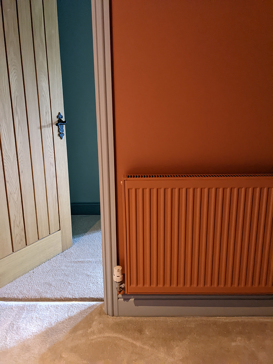 A photo of the radiator on the landing before the cover was added.