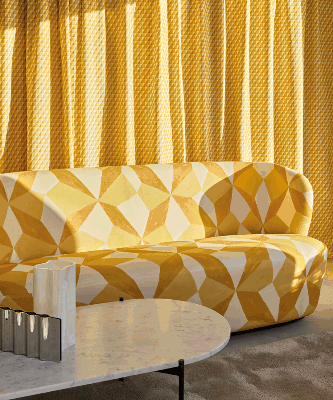 An image showing the new recycled fabric on a sofa with a yellow background and foreground.