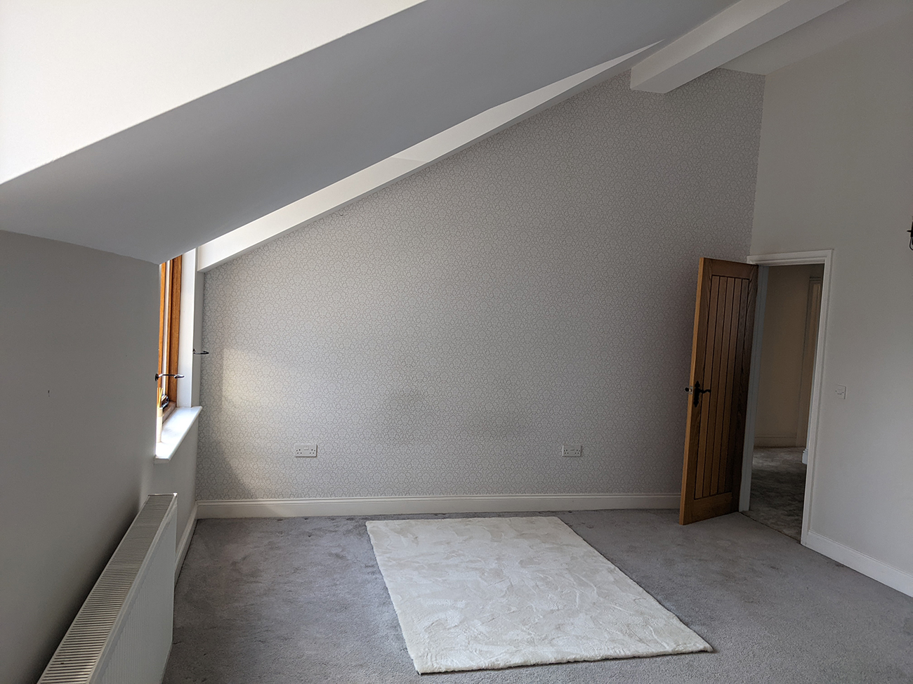 room with angled ceiling 