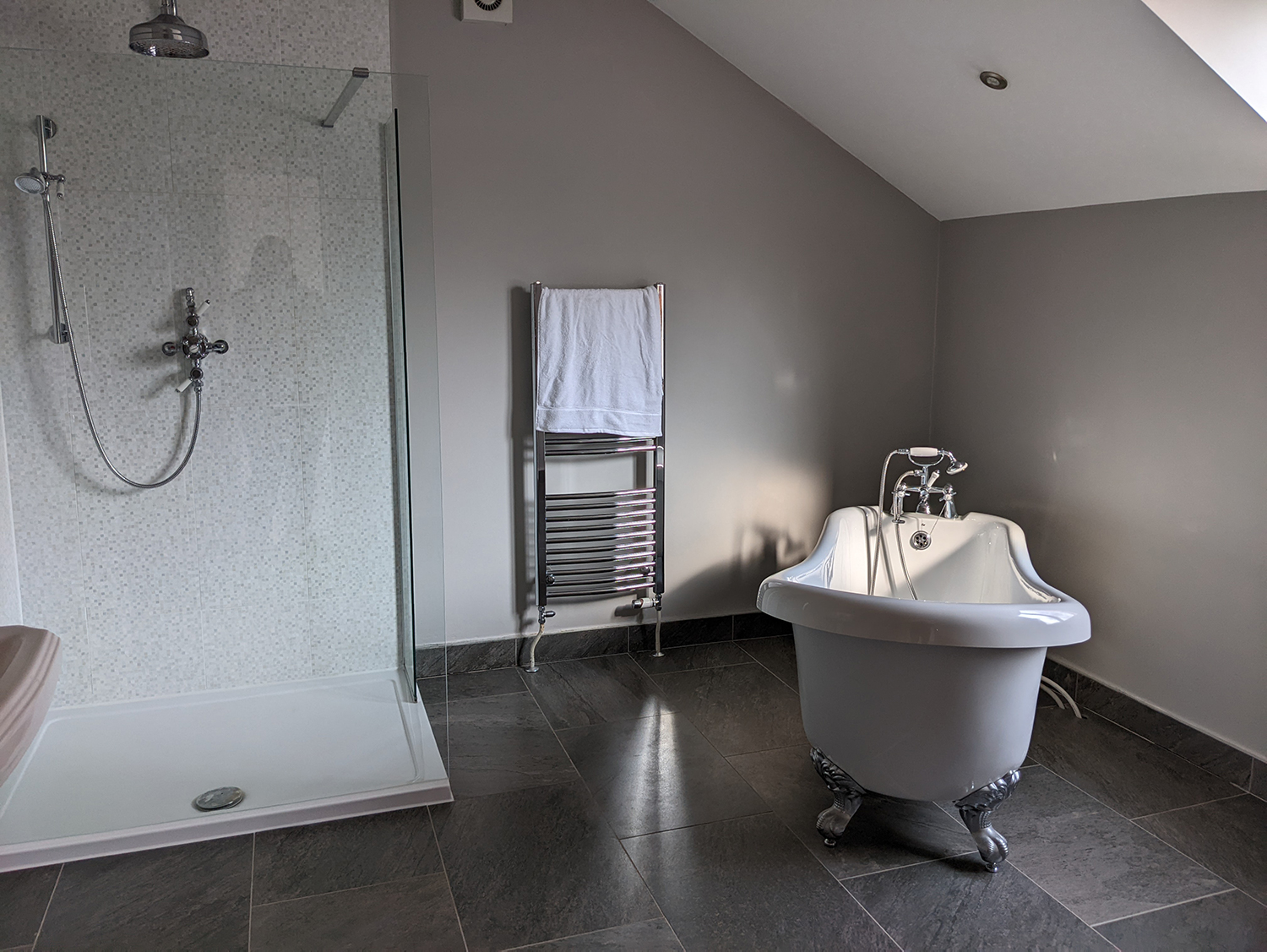 Bathroom with grey walls and free standing bath 