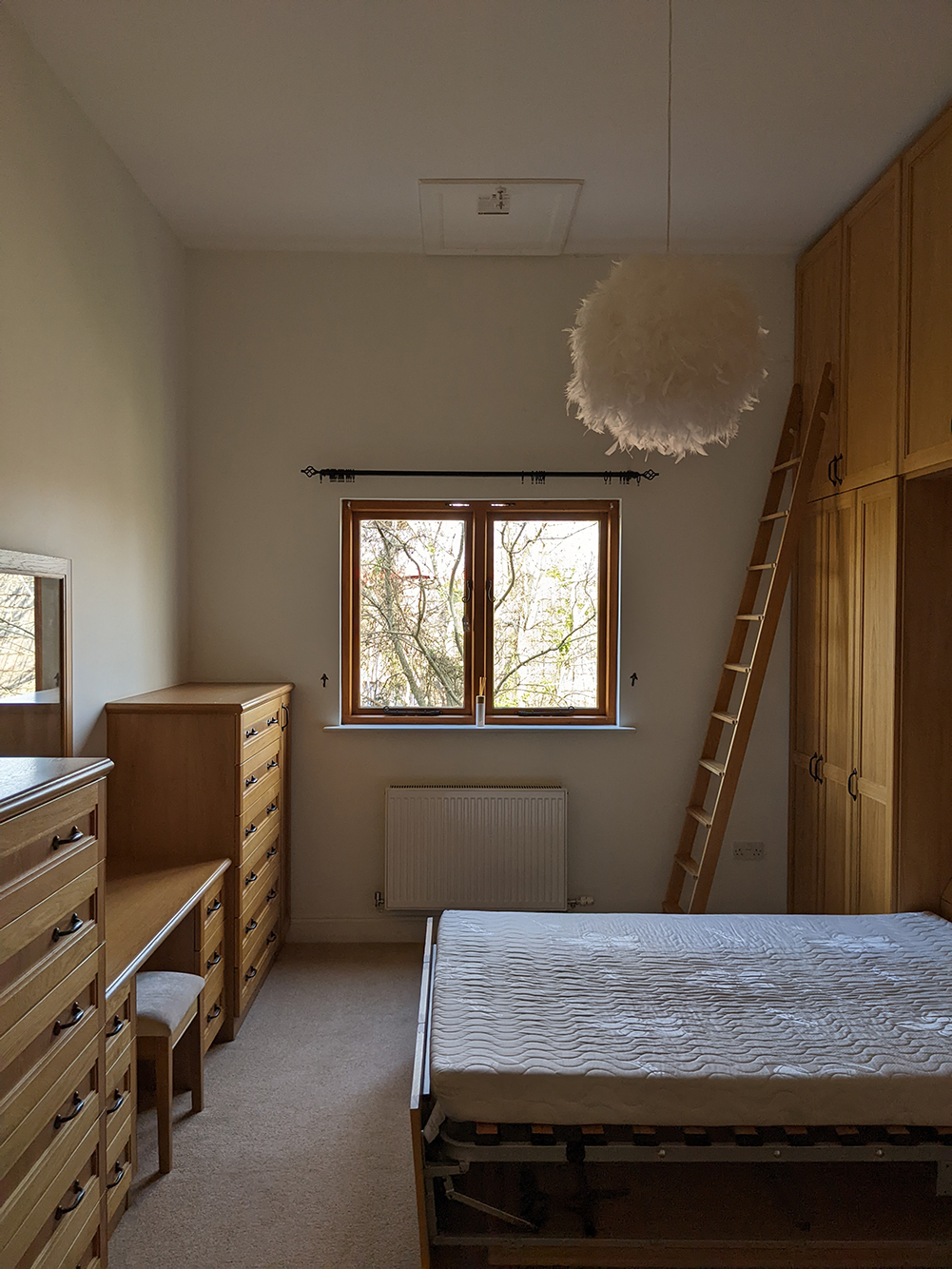 bedroom with built in wardrobes and dressing table