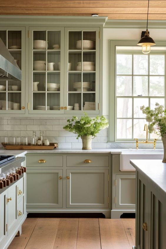 An image from Pinterest of a green traditional kitchen with marble worktops