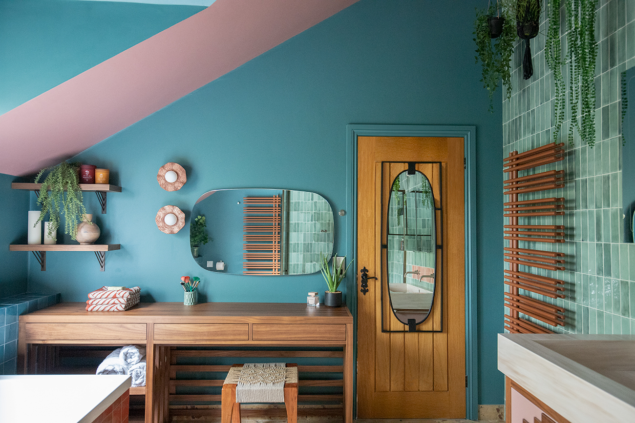 A photo of the dressing table area, with two clay lights above.