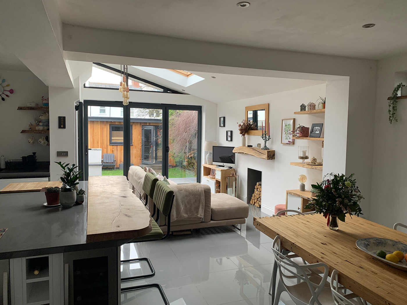 An open plan living room with white walls 