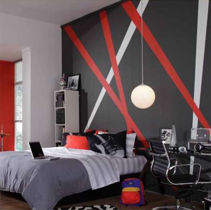 A bedroom with a black feature wall with red and white stripes 