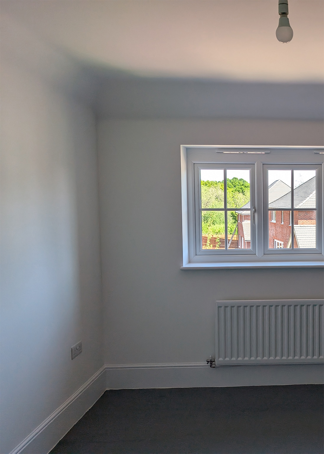 A new build bedroom with large window