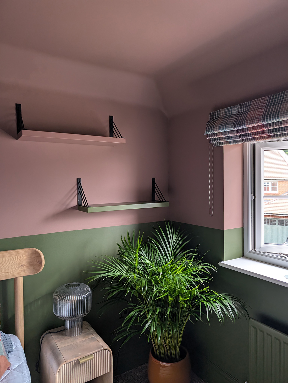 A new build guest bedroom with pink and green walls