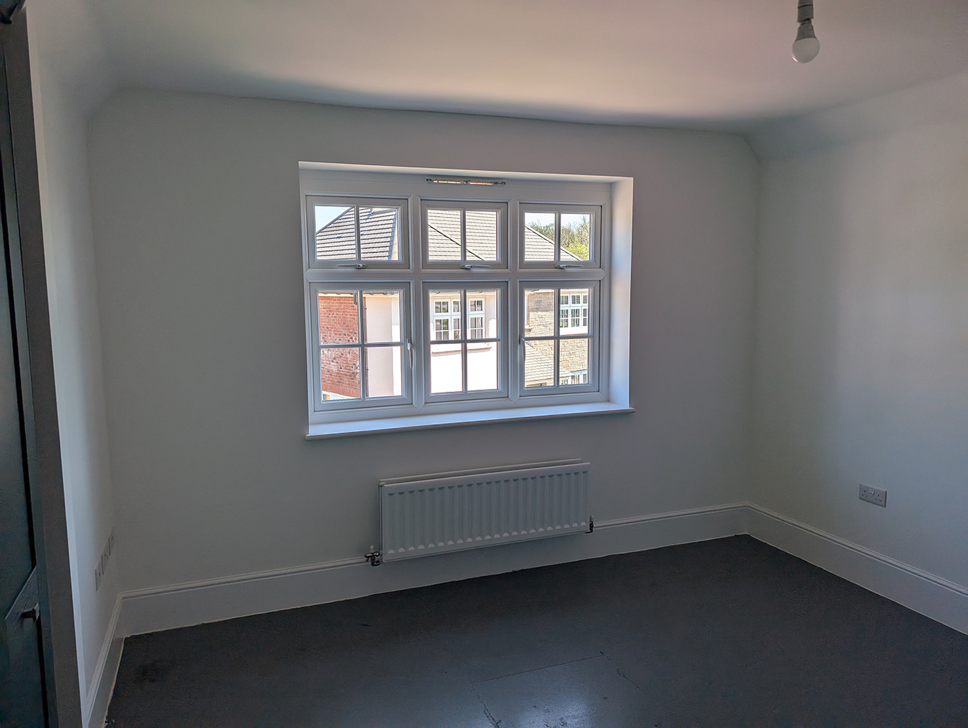 A new build bedroom with large window
