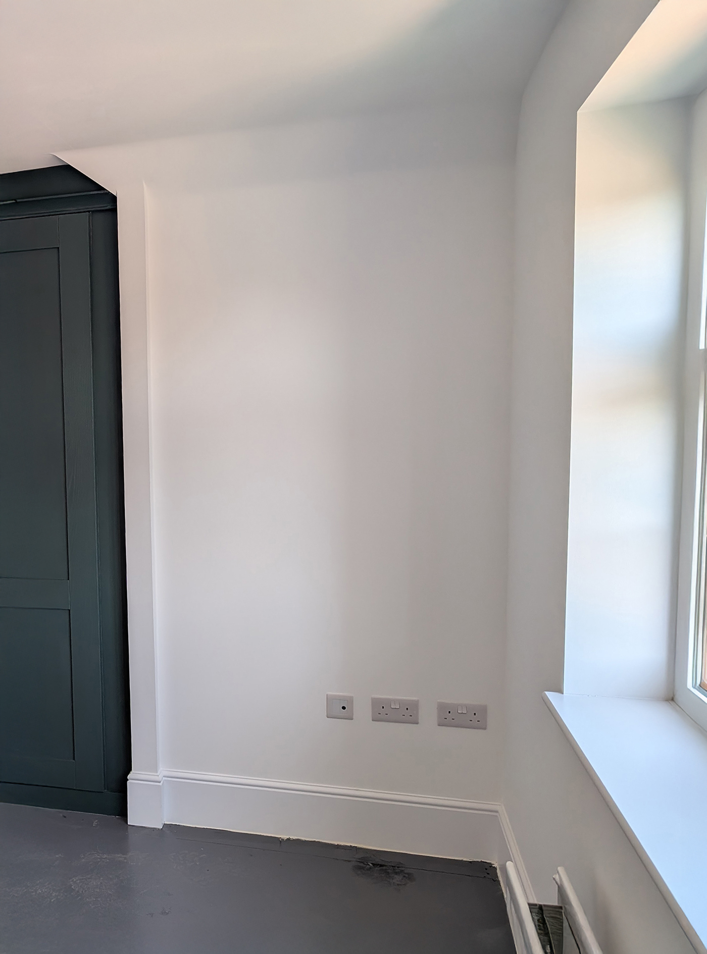 A new build bedroom with white walls