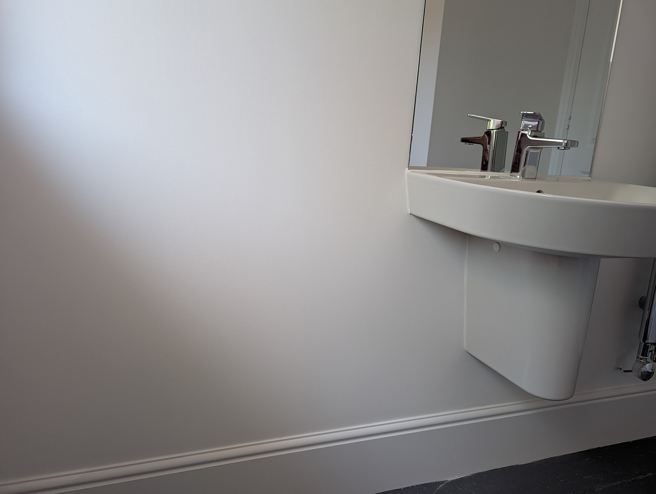 A new build bathroom with pedestal sink