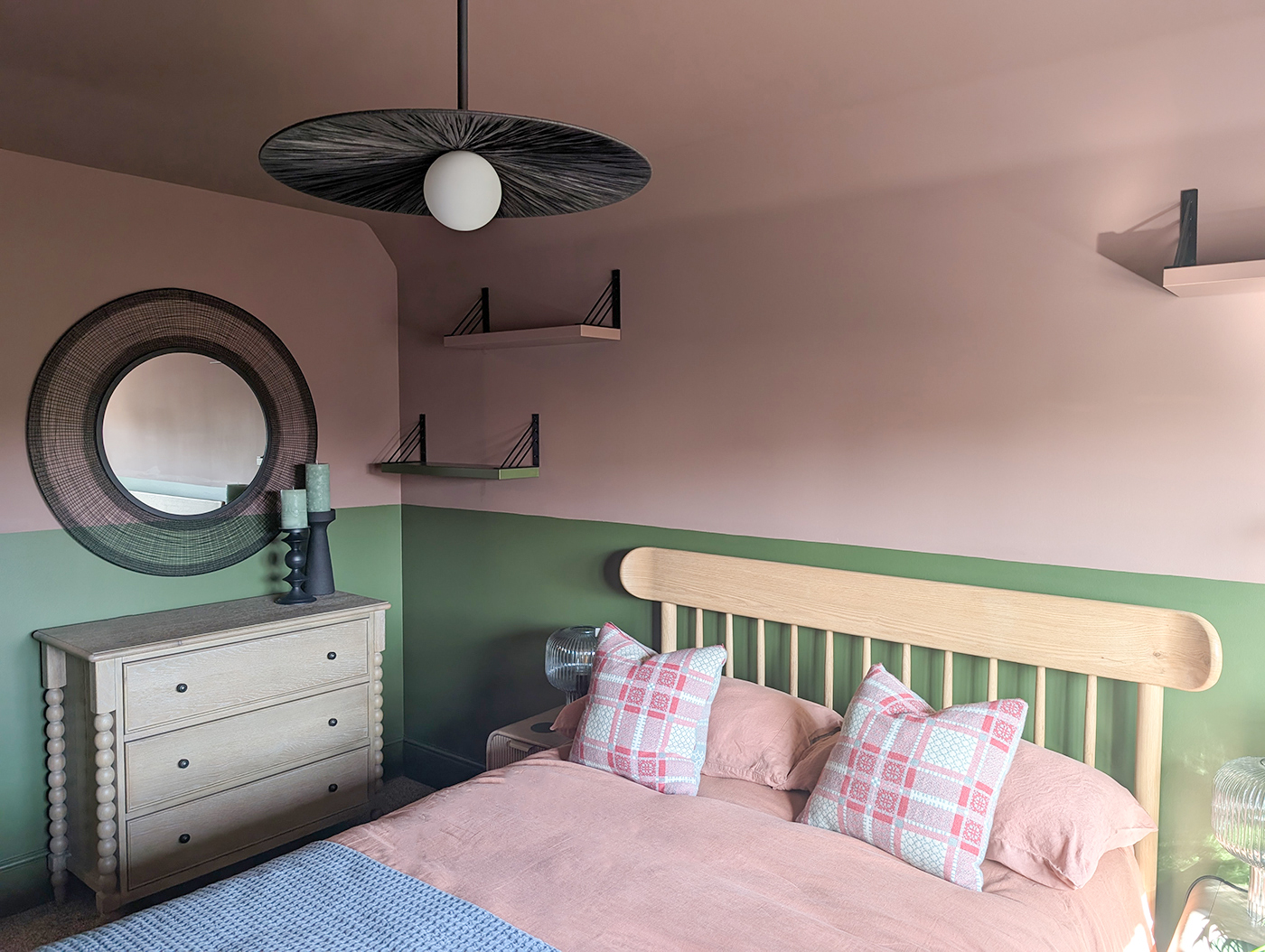 A new build guest bedroom with pink and green walls