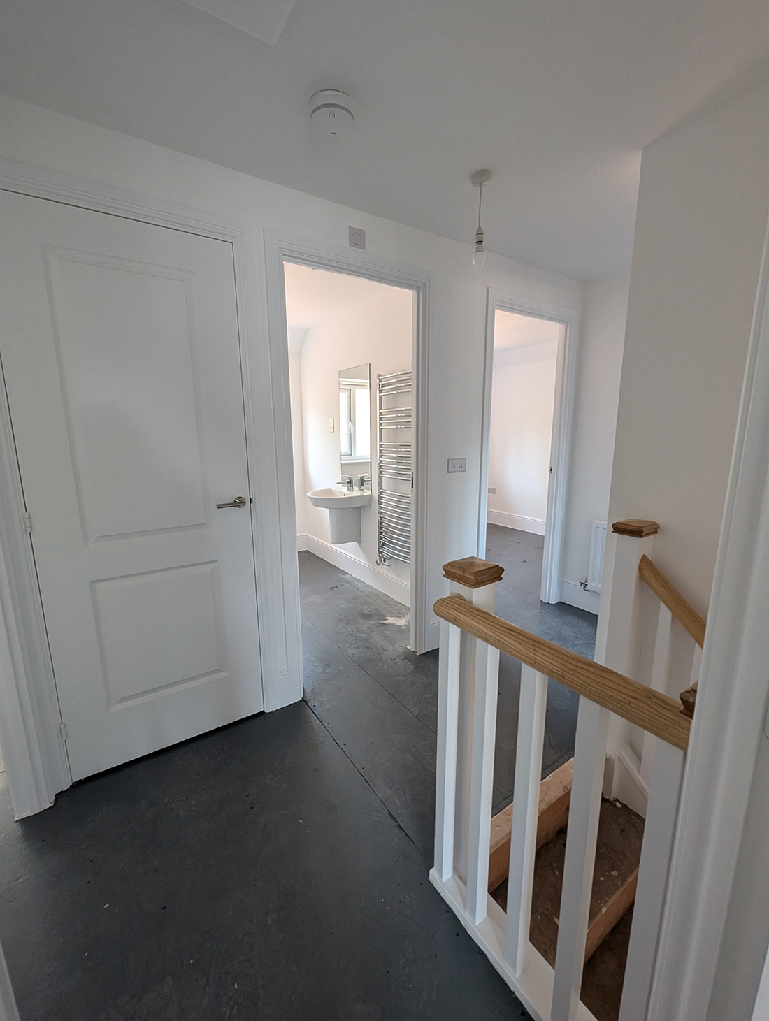 New build home landing with white walls