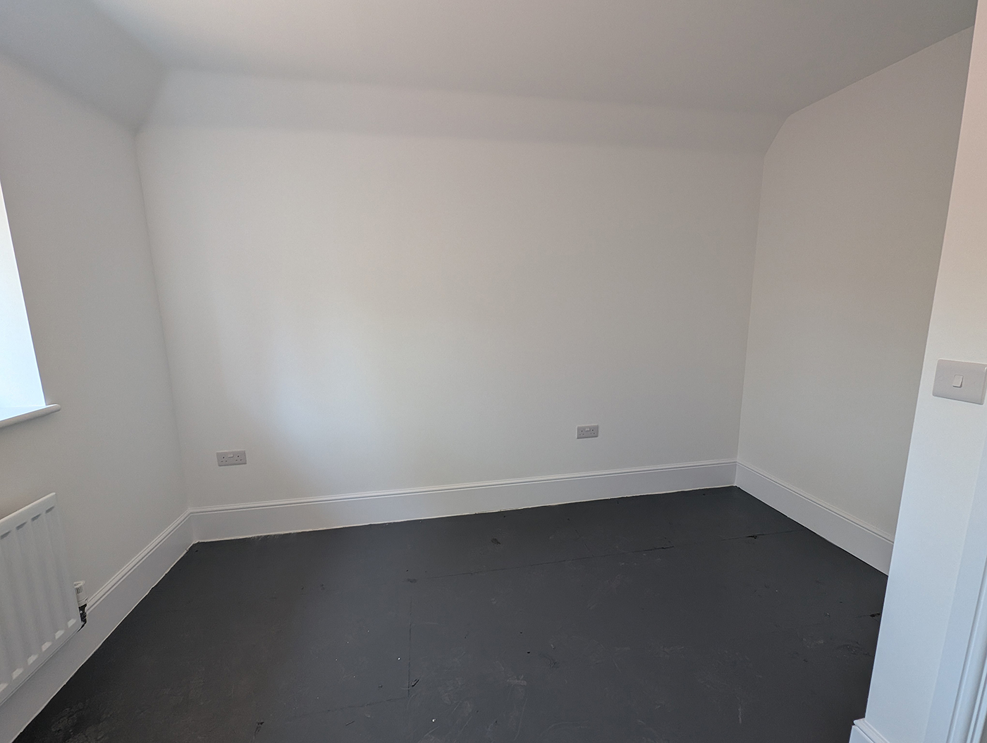 A new build home office with bare white walls