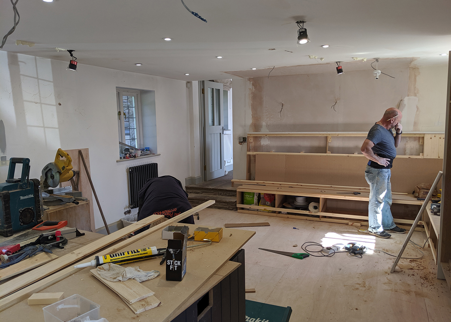 A photo once the chimney has been removed, showing the new seating being built.