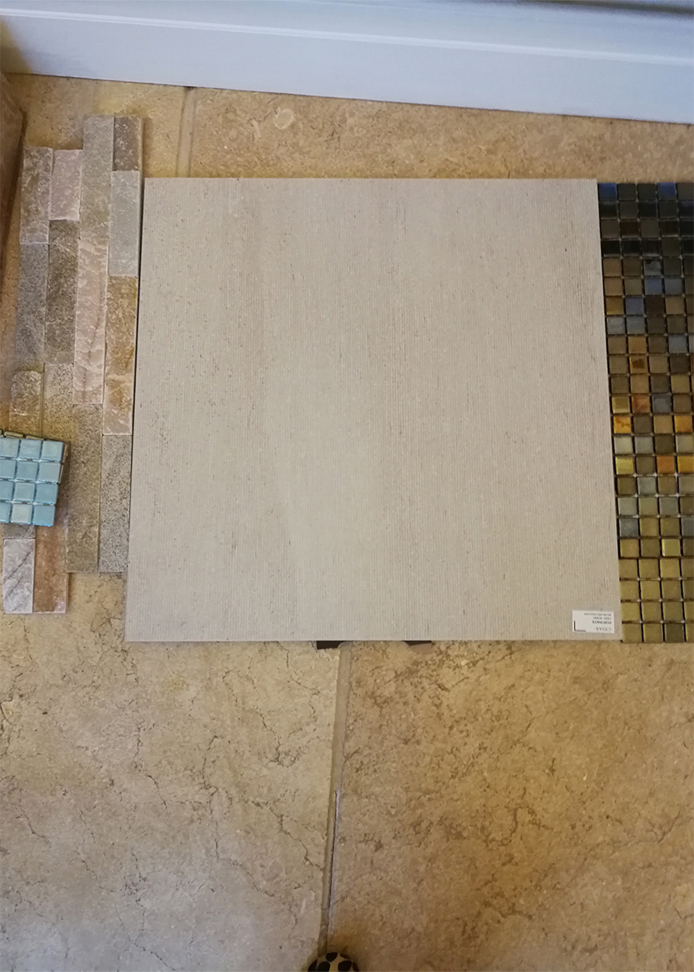 A photo of the chosen tile samples for our luxury pool project.
