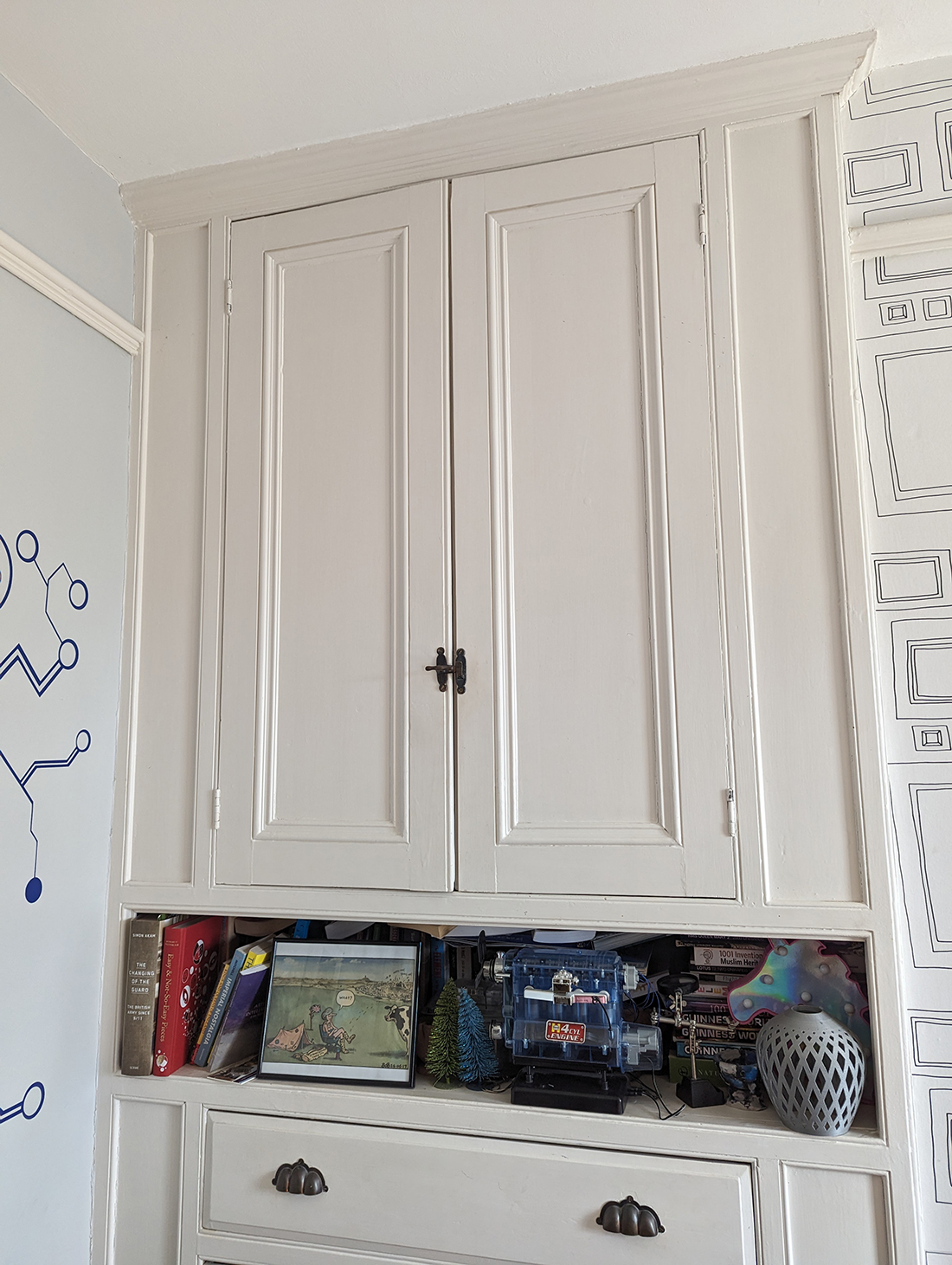 A photo of the original built in Edwardian cupboards in my child's room.