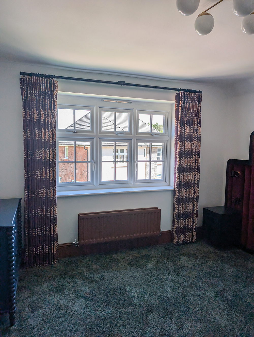 A photo of the finished velvet curtains in the main bedroom.